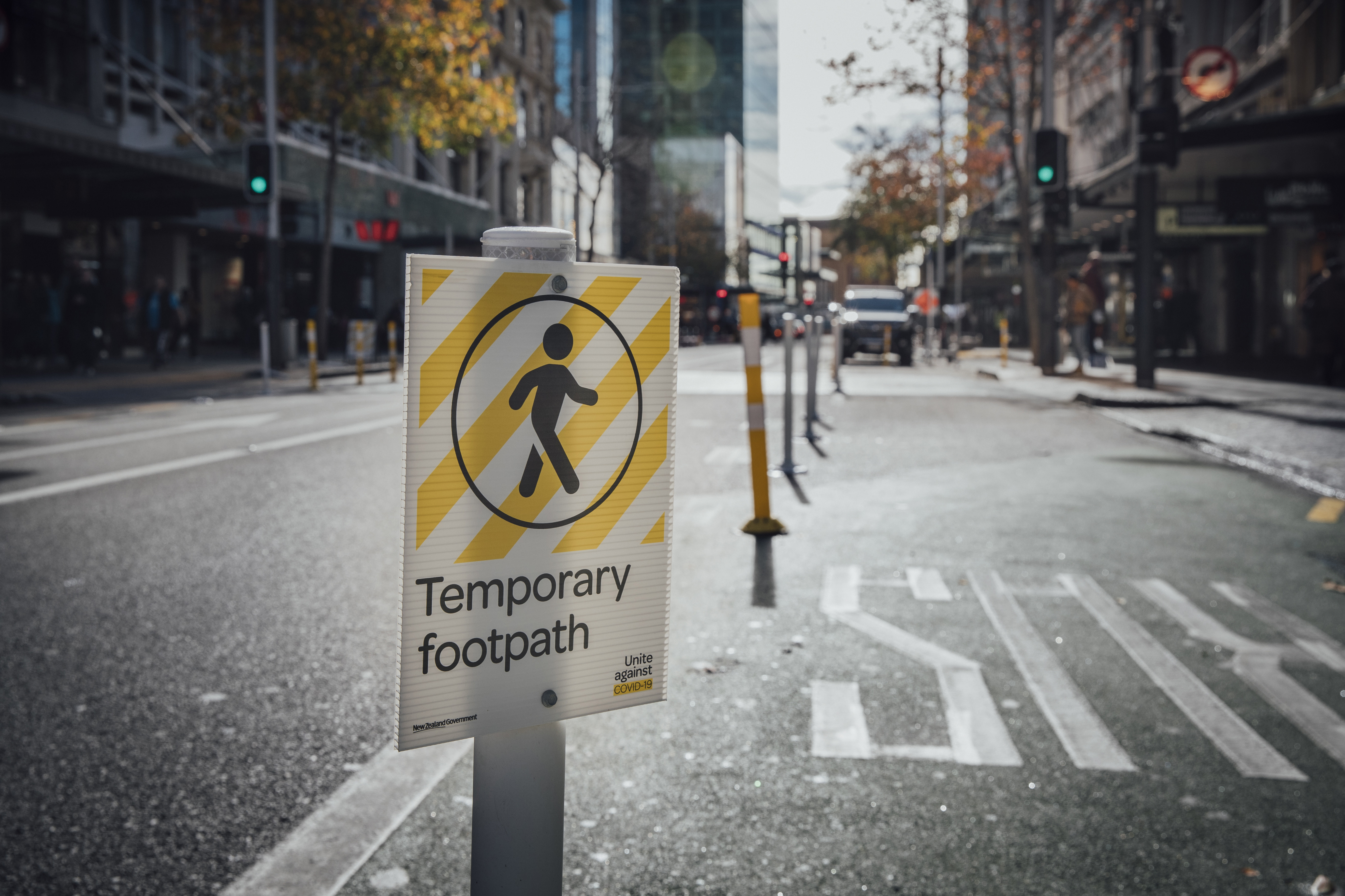 A temporary sign advising to keep social distance